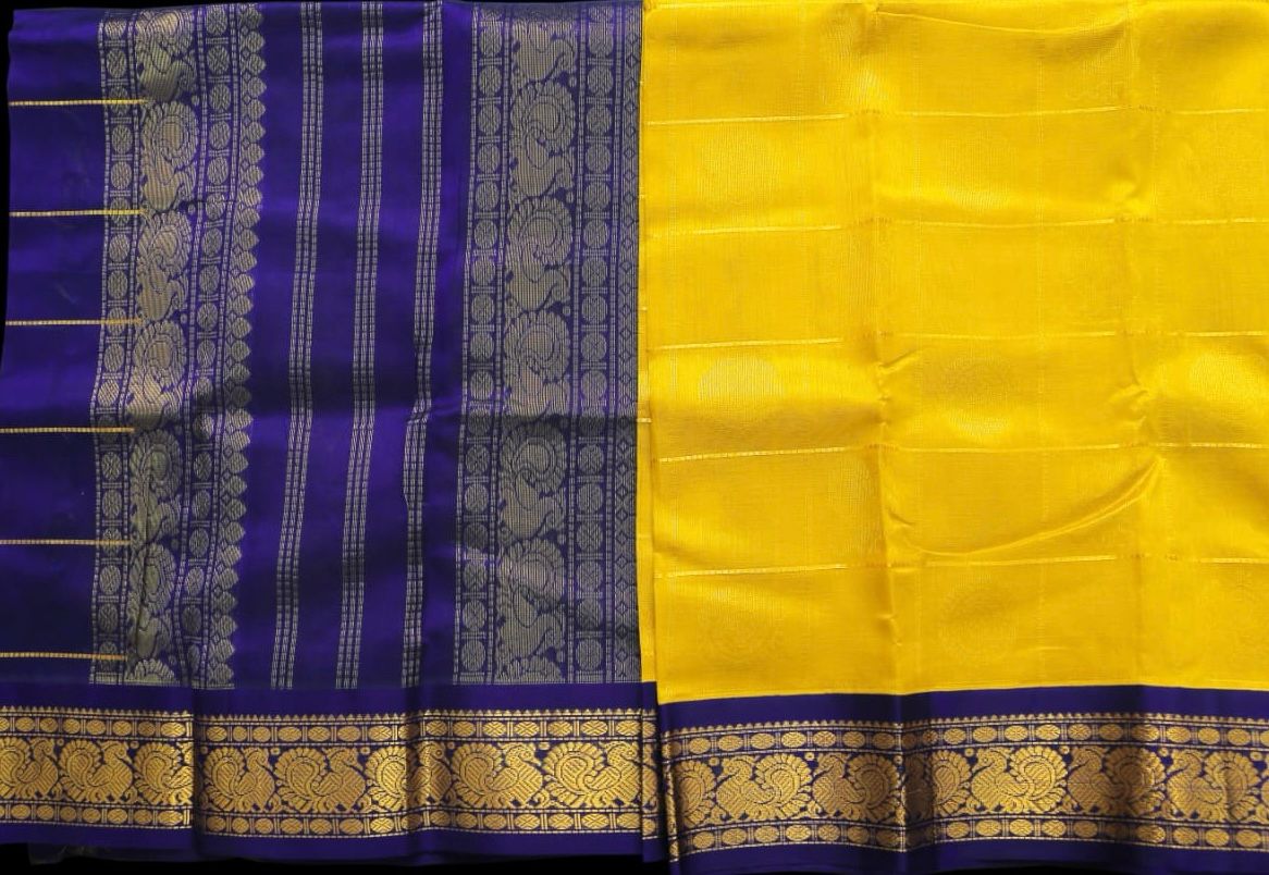 Greenish yellow with navy blue saree