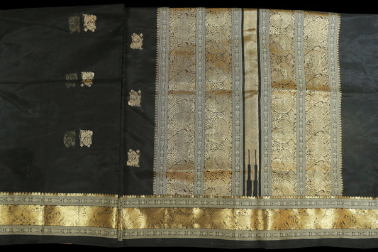 Black with gold zari