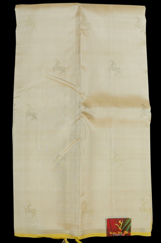 Cream with yellow deer motifs saree