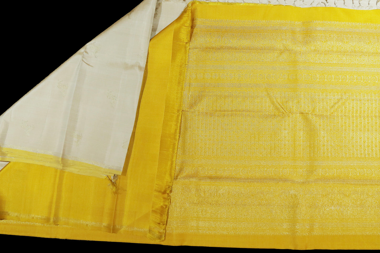 Cream with yellow deer motifs saree