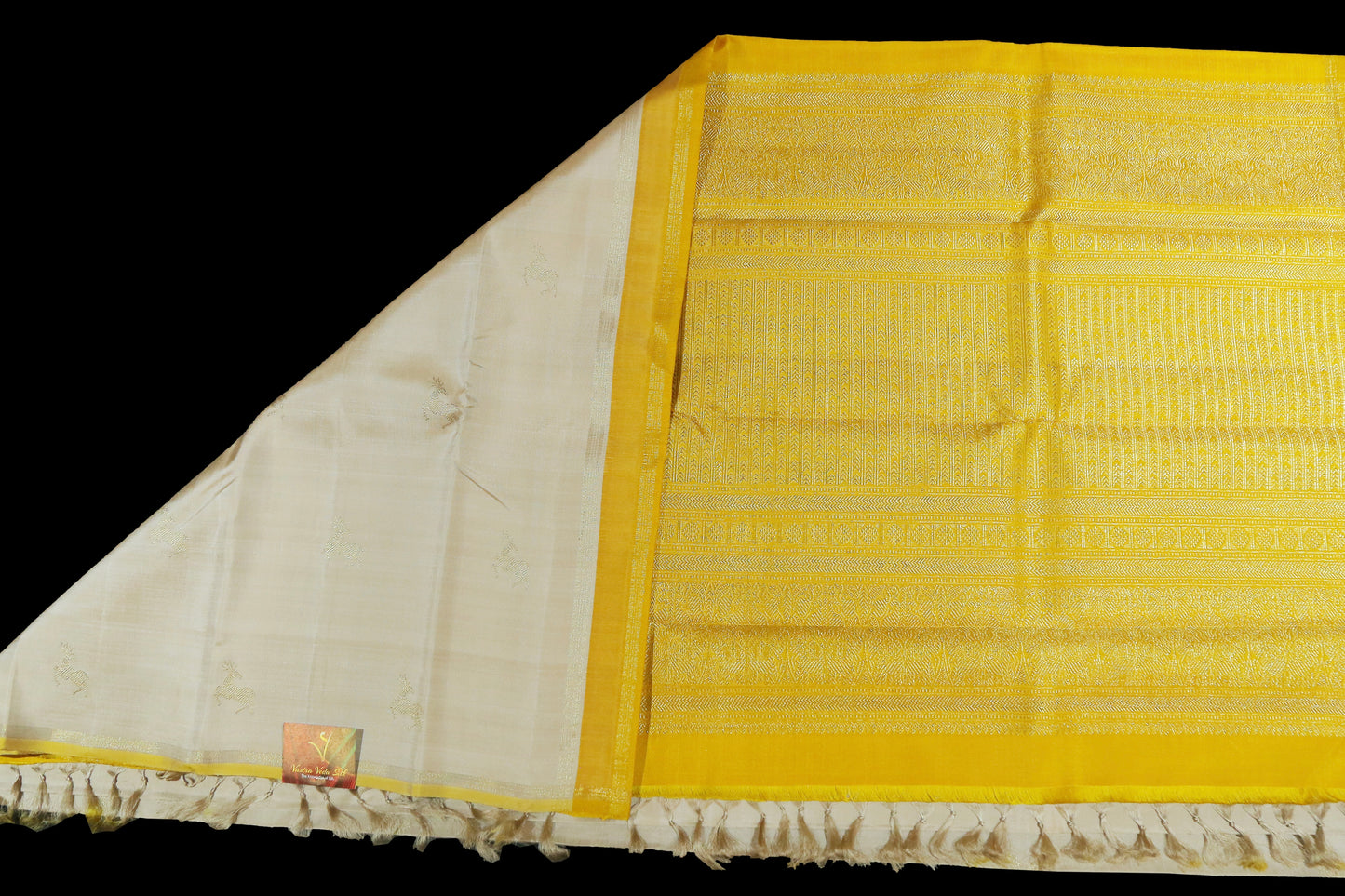 Cream with yellow deer motifs saree
