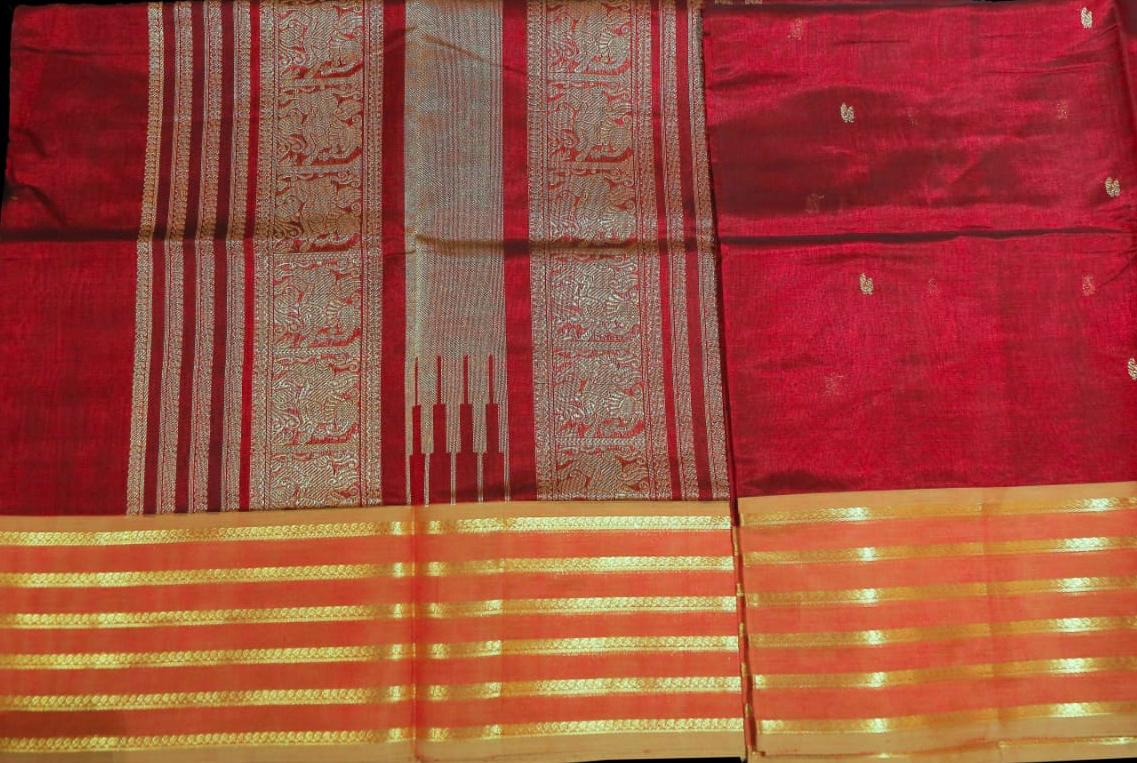 Bright red with zari saree