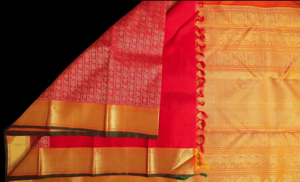 Bright red with olive green saree