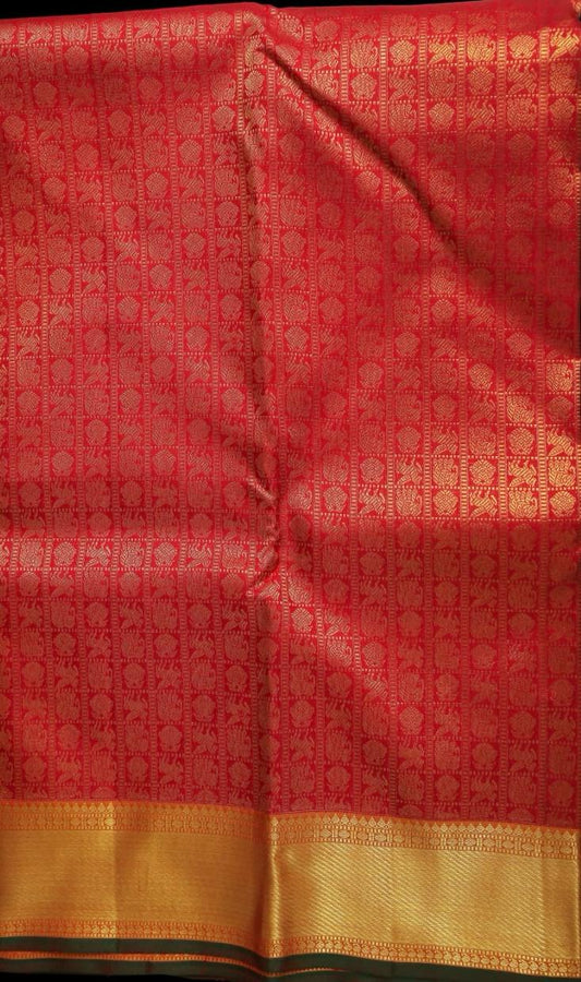 Bright red with olive green saree